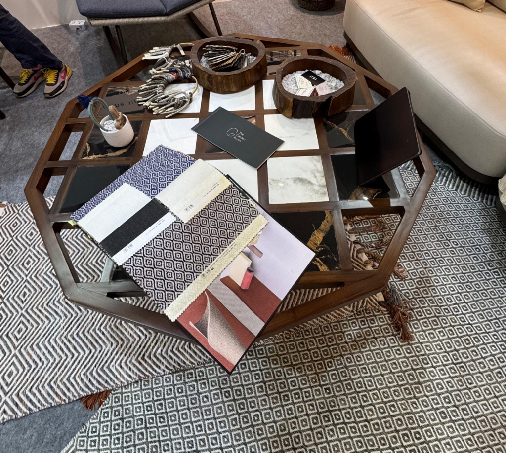 Yucca Coffee Table styled with material swatches and showroom layout.